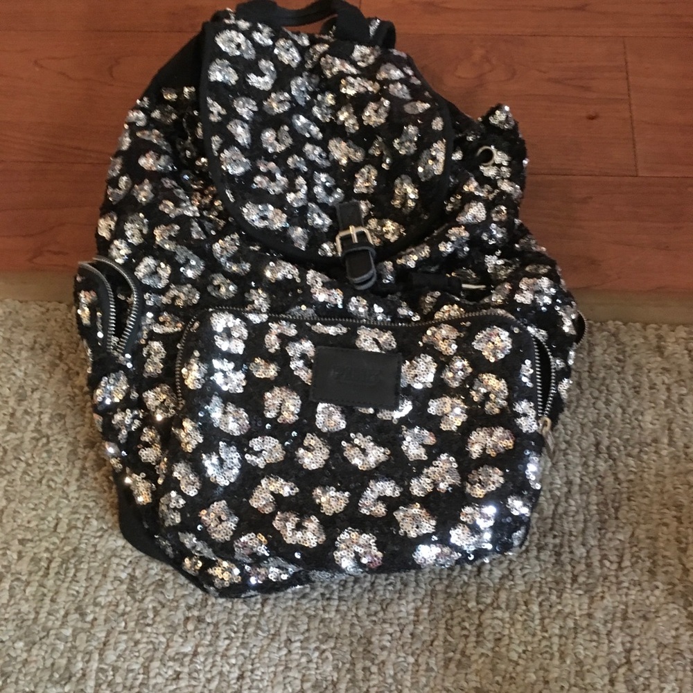 Pink Victoria’s Secret cheetah print backpack